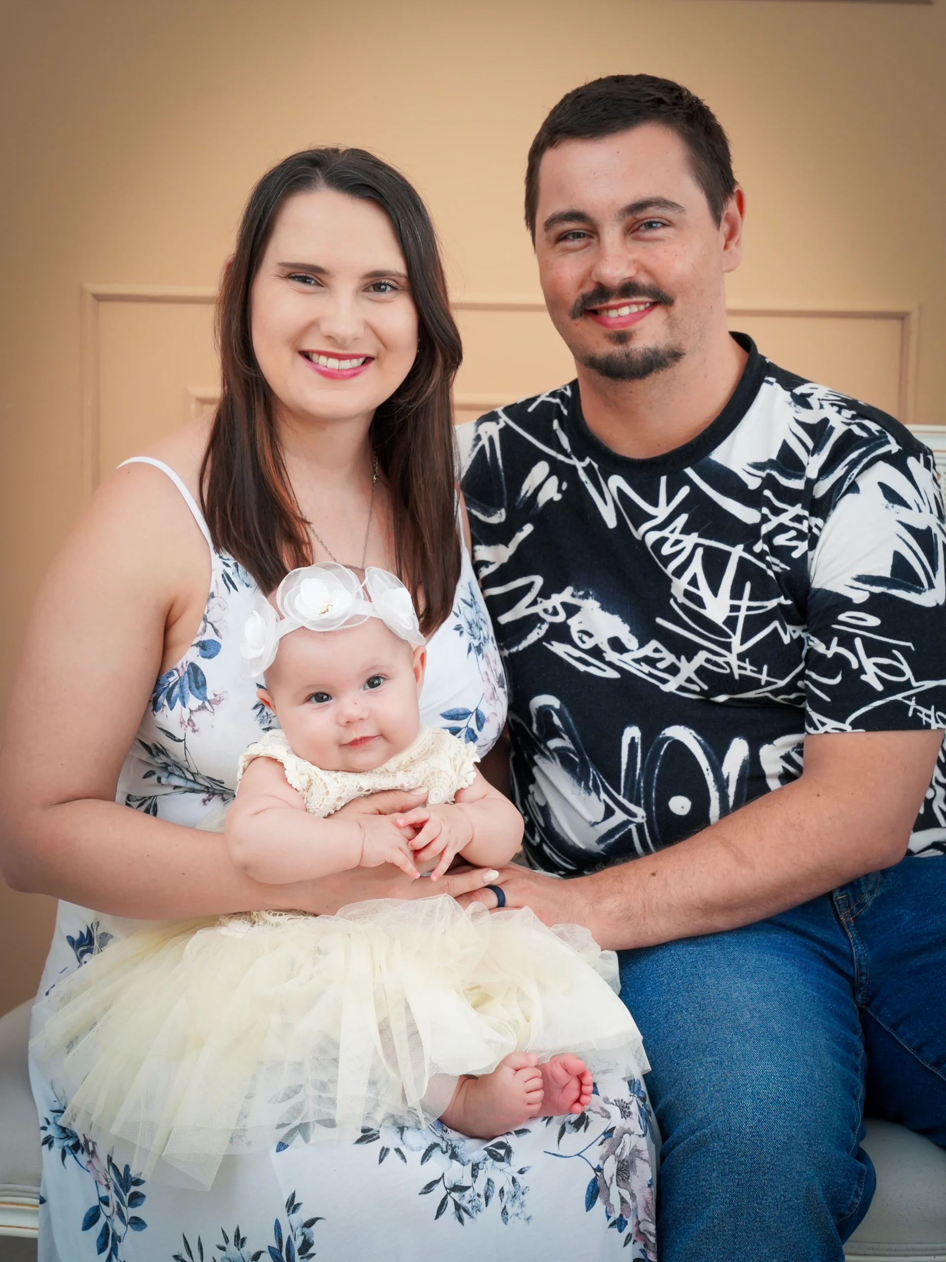 Smiling couple with baby daughter on a blog about lifestyle, fashion, and beauty.